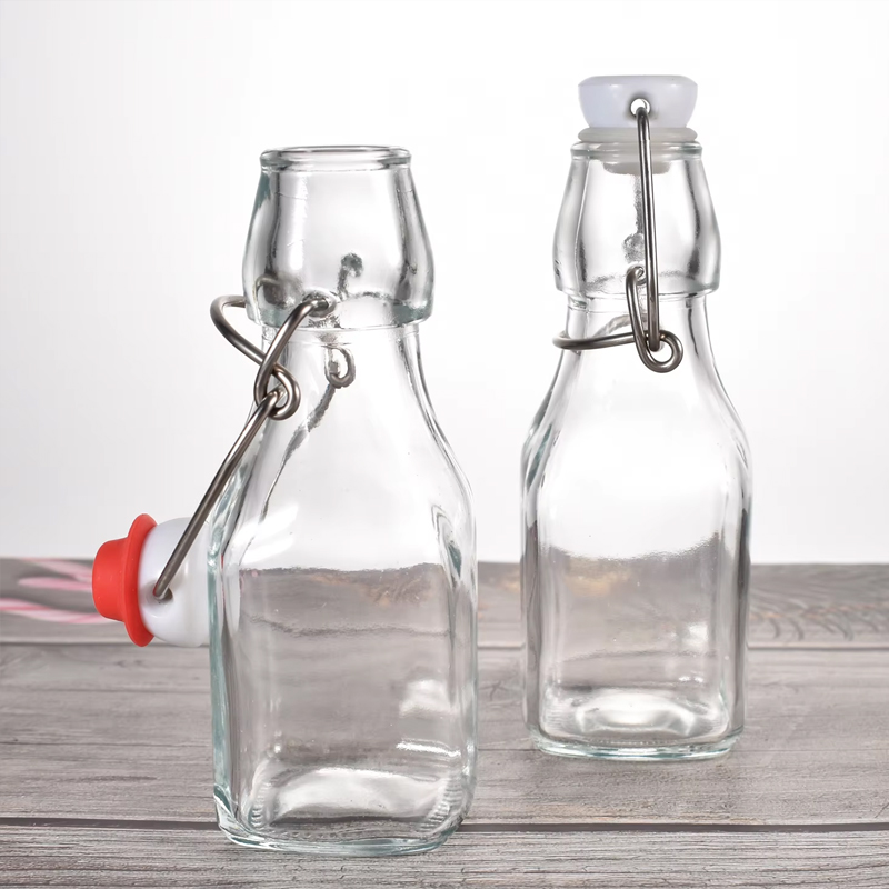Bouteilles en verre à couvercle rabattable transparent de 120 ml