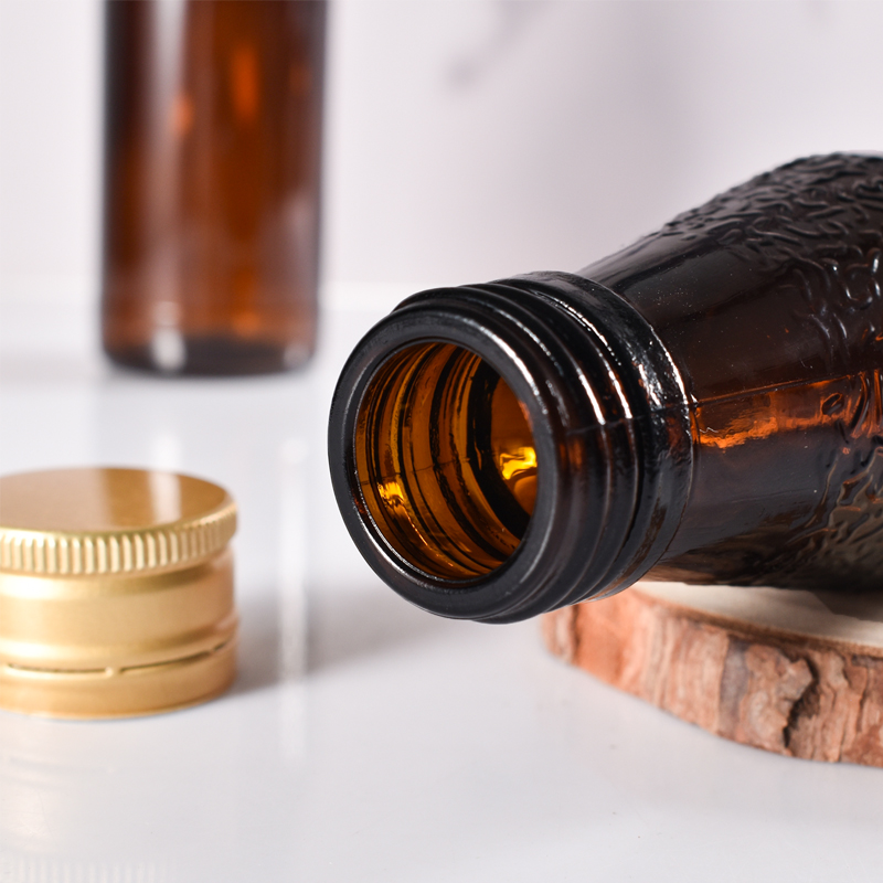 Fabricant de bouteilles de sirop en verre ambré recyclées en verre scellé de 100ml avec capuchon en métal