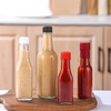 Ventes chaudes petite bouteille en verre 90 ml 250 ml 150 ml bouteilles Woozy pour verre de sauce piquante